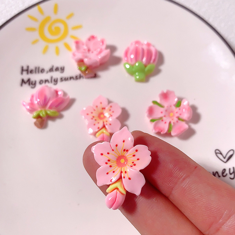 Nuevos accesorios de resina de bricolaje de flor de durazno rosa de dibujos animados, pegamento de crema, carcasa para teléfono móvil, accesorios para el cabello, zapatos, colgantes de hebilla, materiales hechos a mano