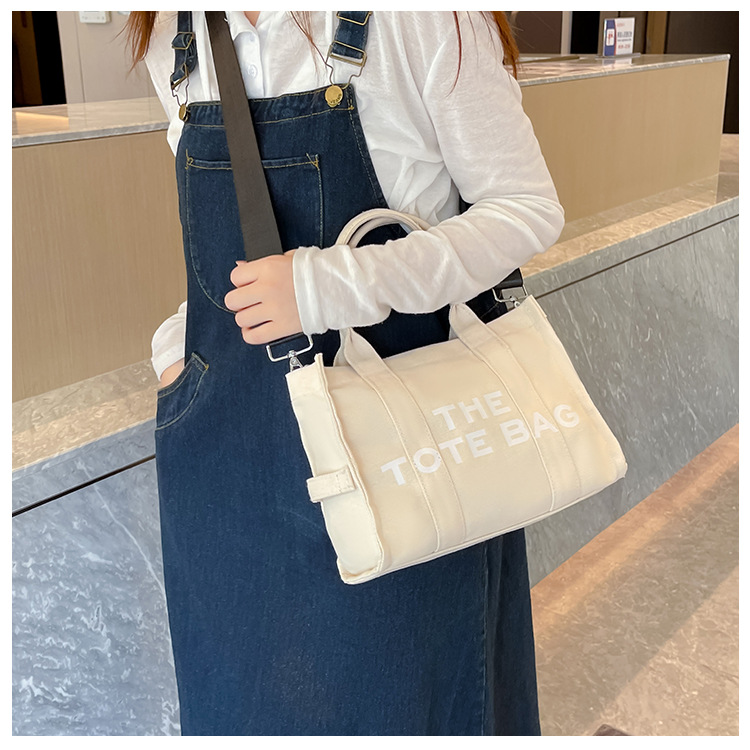 Bolso de lona Hebei Baiou para mujer, de color sólido con estampado de letras, bolso bandolera de un solo hombro con estampado de letras.