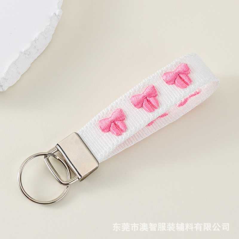 貿易ジュエリーハンギングストラップ携帯電話キーホルダーバッグ装飾コンピュータ刺繍文字隆起パターンパーソナライズされたアクセサリー|undefined
