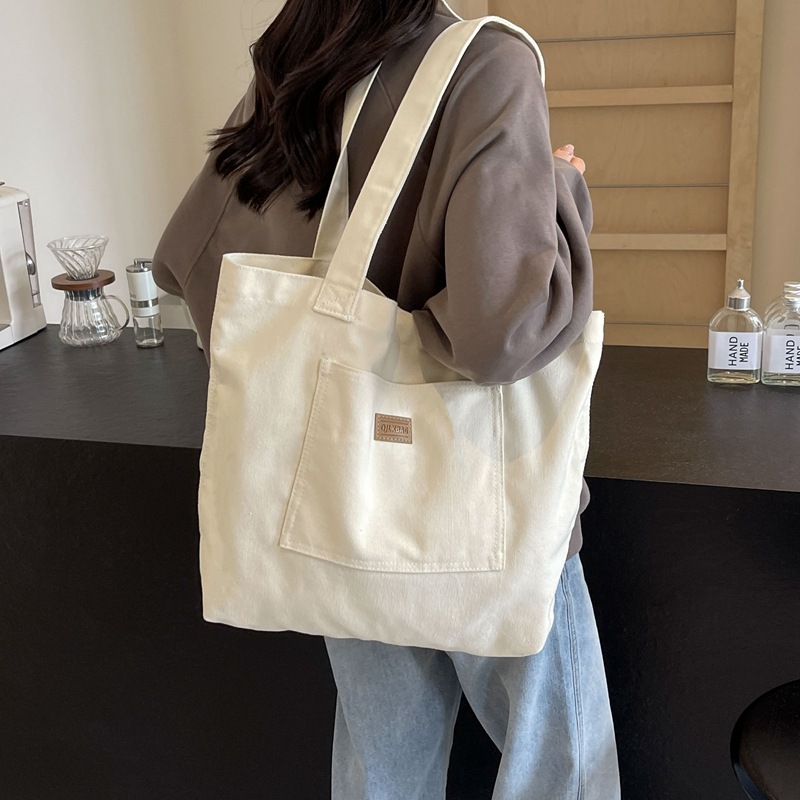 Bolso de lona para mujer 2024 nuevo bolso de hombro de gran capacidad de color sólido casual simple y versátil bolso de clase al por mayor