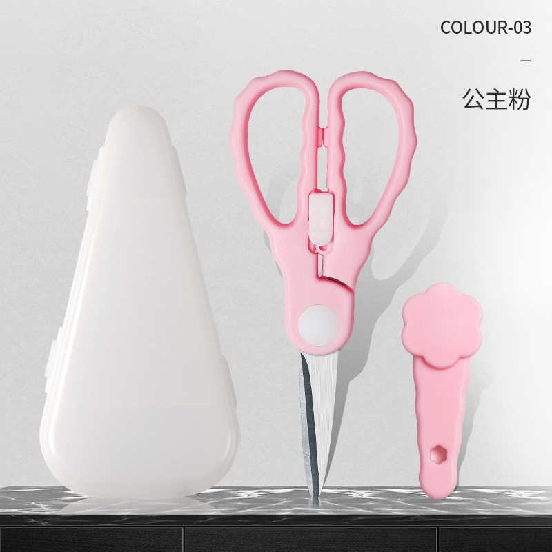 陶磁器のサプリメントは赤ちゃんの食べ物を切ります。はさみは携帯で肉を切ります。