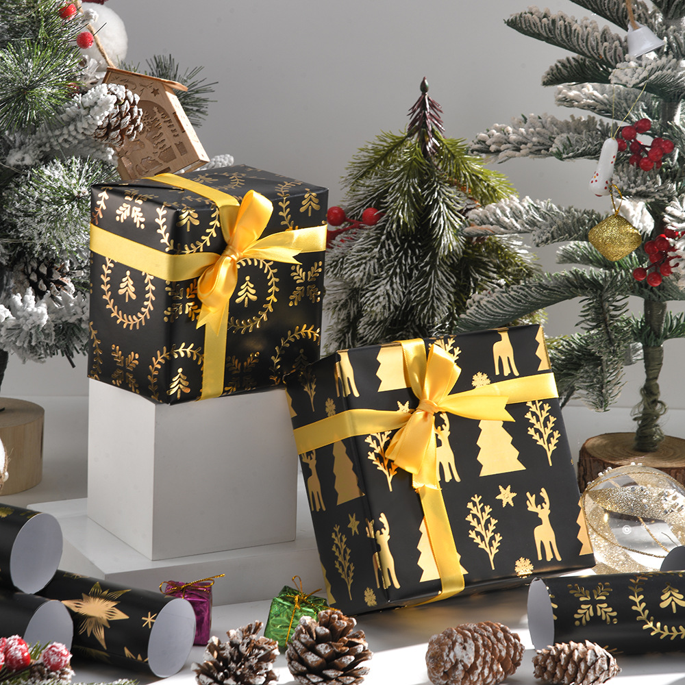 Nuevo papel de regalo de oro negro de Navidad transfronterizo papel de cobre brillante copo de nieve papel de regalo de ciervo de Navidad papel de regalo