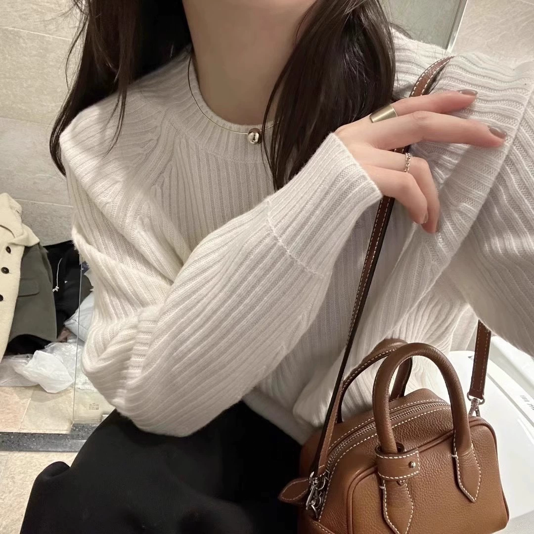 Solid demi-season woolen knitted short sweater with a round collar