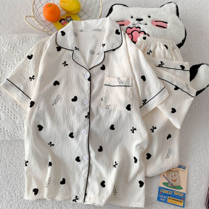 Al por mayor transfronterizo nuevo pijama de mujer tres piezas cardigan con solapa mangas cortas pantalones cortos KT gato dibujos animados cubierta de ropa doméstica