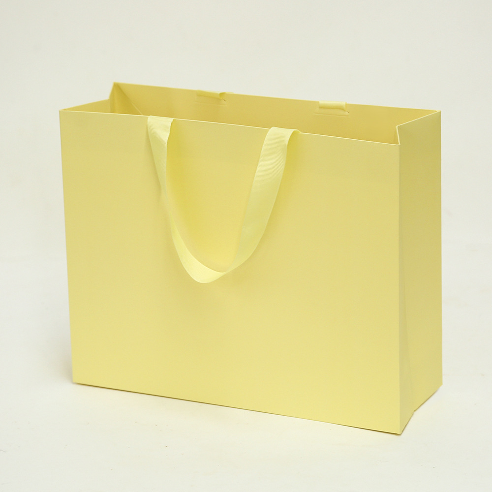 Bolsa de cartón blanco logotipo tienda de ropa bolsa de mano bolsa de regalo espesa bolsa de regalo de Navidad se puede imprimir