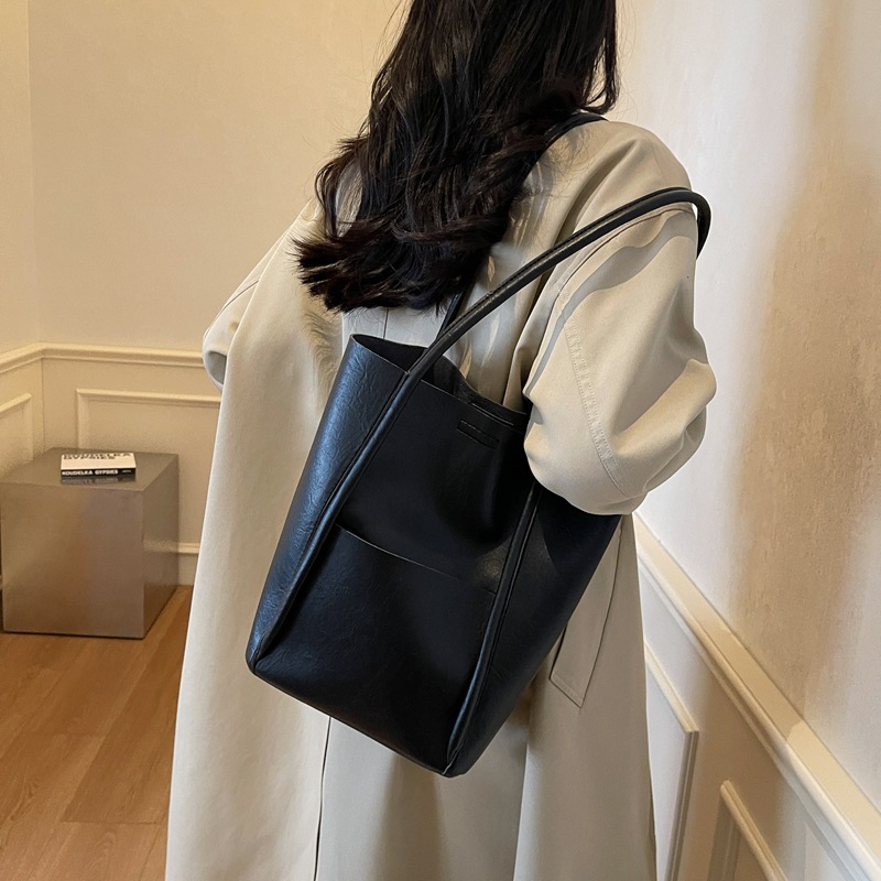 Bolsos de balde transfronterizos para niños 2024 nuevos bolsos de mujer de alto nivel retro bolsos de hombro bolsos de mano simples casuales