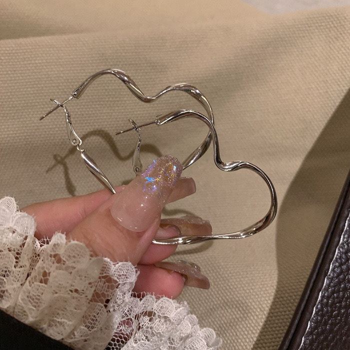 Pendientes de alta gama de lujo ligero transfronterizo de aguja de plata de galvanoplastia de oro real, pendientes de personalidad de nicho, pendientes de alta gama de moda al por mayor