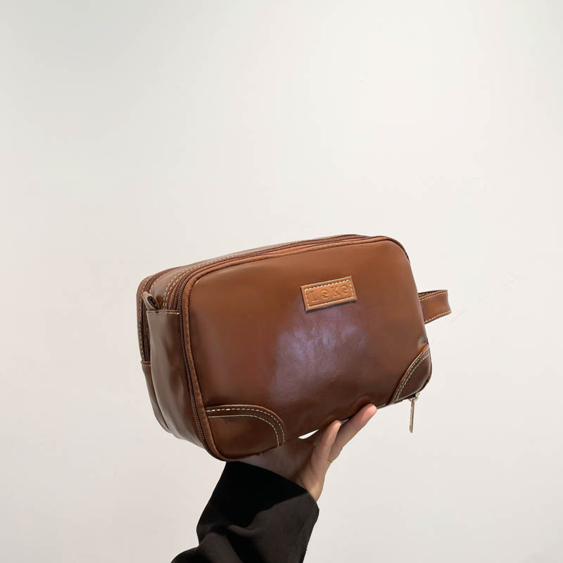 2025 nuevo paquete de lavado multicapa de gran capacidad, bolsas de maquillaje comerciales simples, bolsas de almacenamiento multifuncionales para viajes de cuero pu