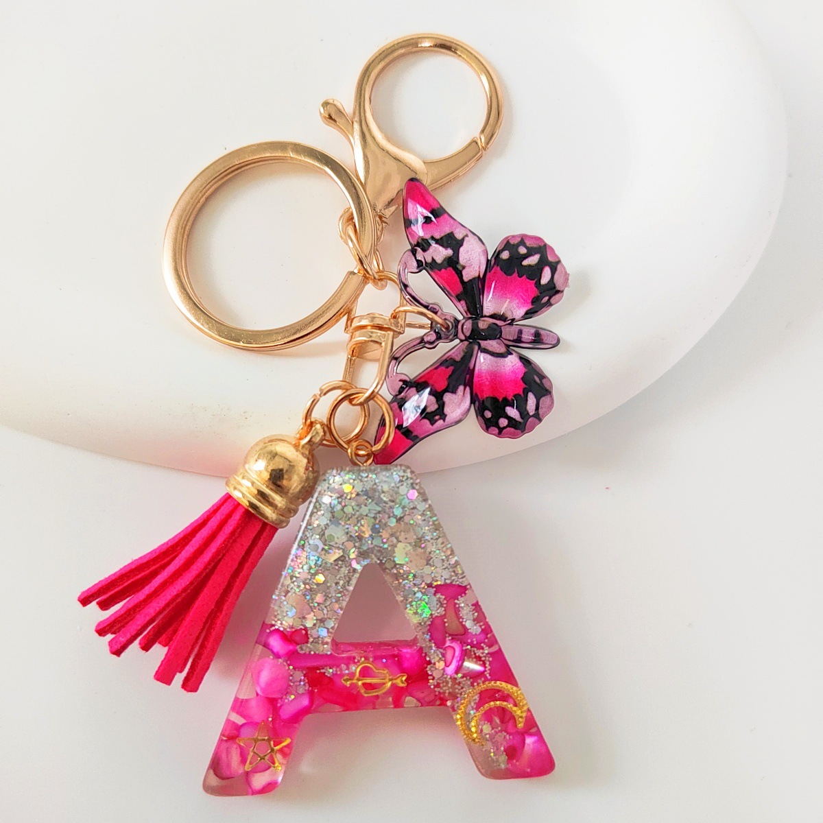 Inventario transfronterizo nueva resina bicolor mariposa borda llavero colgante estrella luna accesorios de joyas