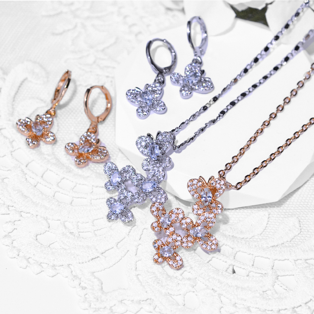 Diseño de mariposa popular transfronteriza aretes de zircon collar conjunto de joyería para mujeres pendientes de aretes de zircon colgante joyas exquisitas para mujeres