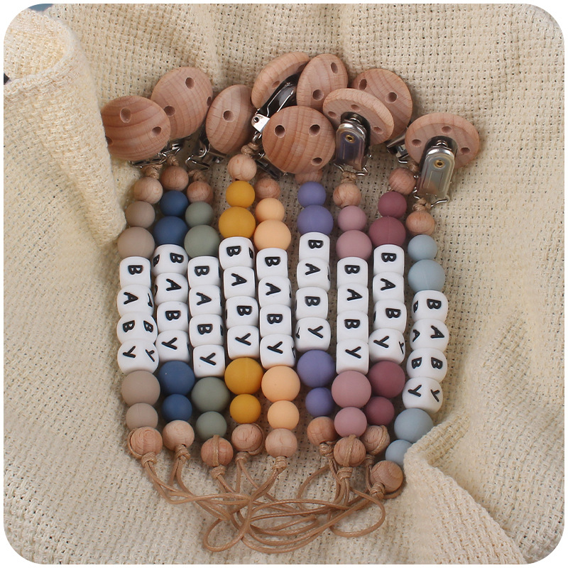 Nuevos suministros para bebés Haya agujero redondo clip bebé creativo DIY chupete Cadena de silicona mordedura de juguete cadena anti-caída