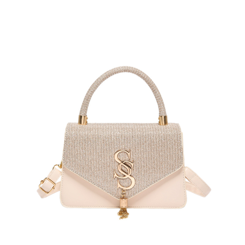 Bolsos de textura, la nueva moda de este año, la cadena de borlas de letras, el pequeño bolso cuadrado, la moda de las mujeres, el bandolera de un solo hombro