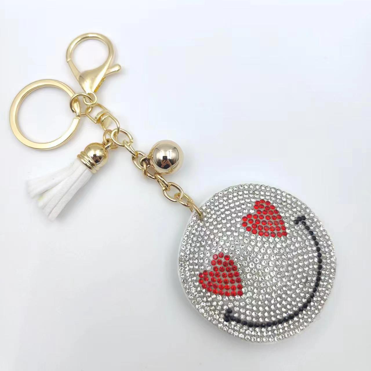 Nuevo creativo cara sonriente coreana llavero de diamante de moda borda de dama bolsos colgantes joyerías de comercio exterior al por mayor