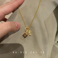 库宁 vintage中古跑环十字架骰子项链轻奢高级感百搭毛衣链
