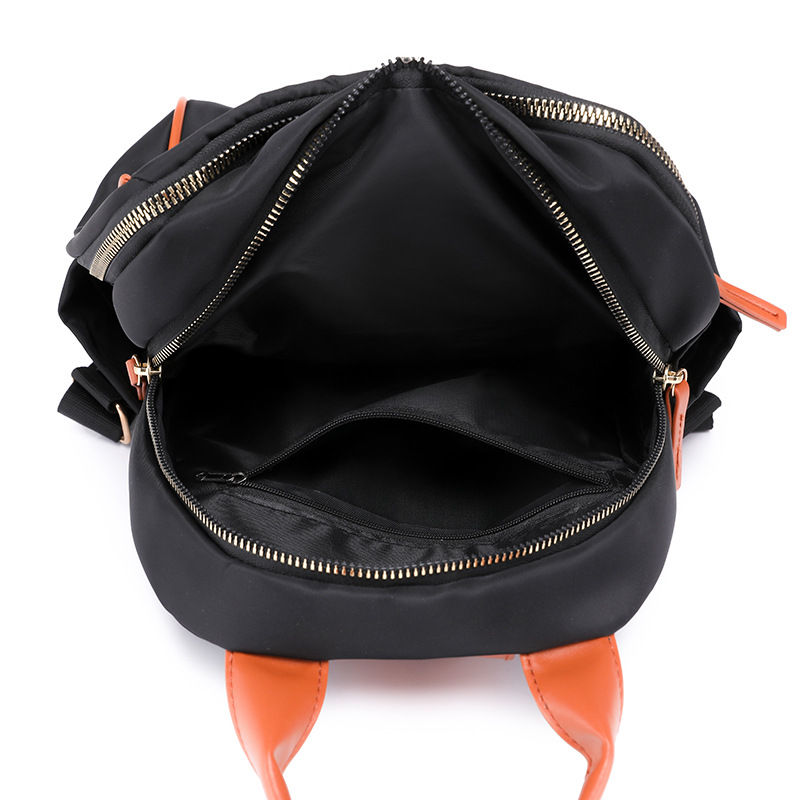 Mochila portátil para mujer 2024 nuevo estilo nylon fuera de viaje mochila simple bolsa de escuela de estudiante de gran capacidad al por mayor