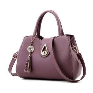 Fashionable City Style Mom Bag with Tassel, PU Material, Large Capacity, Lock Closure, and Middle Hardness