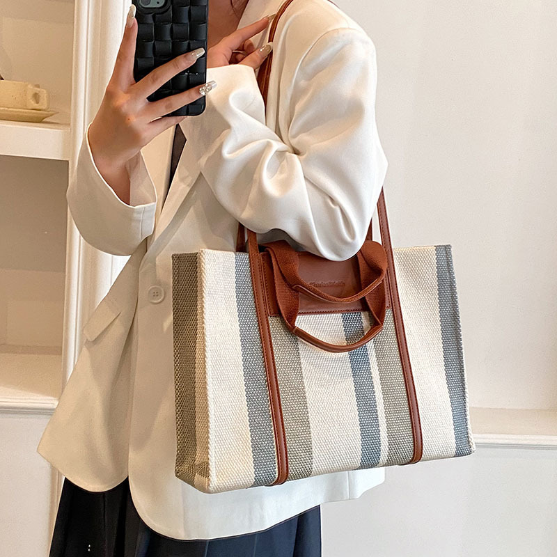 Bolso de mujer nueva línea transfronteriza lienzo color contraste bolso de mano rayas nicho de moda alta moda bolso de hombro