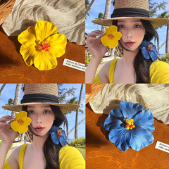 ネットの赤いモデルのシミュレーションの扶桑の花のヘアピンの高級な雰囲気感のサイドは海辺の休暇のボヘミアンの髪の輪を挟みます。