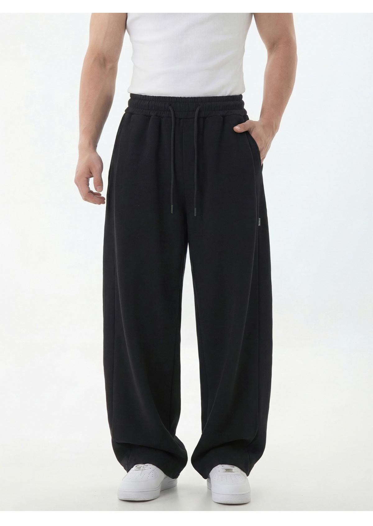 Pantalon de jogging pour homme à empiècements texturés, coutures asymétriques modernes, entrejambe basse, coupe décontractée, tombé impeccable._voghion.com