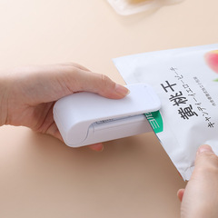 Portable mini sealing machine creative household food plastic bag opening sealing machine travel hand pressure heat sealing machine