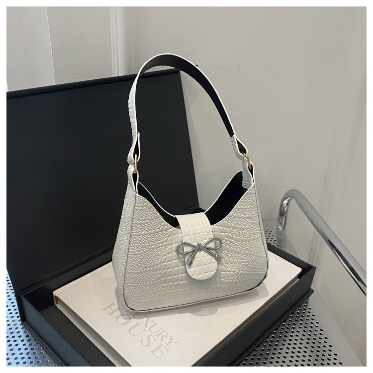 Bolso de mano con lazo de sentido de alta gama para mujer 2024 nuevo bolso de mensajero de cadena de primavera mini bolso de axila de un solo hombro