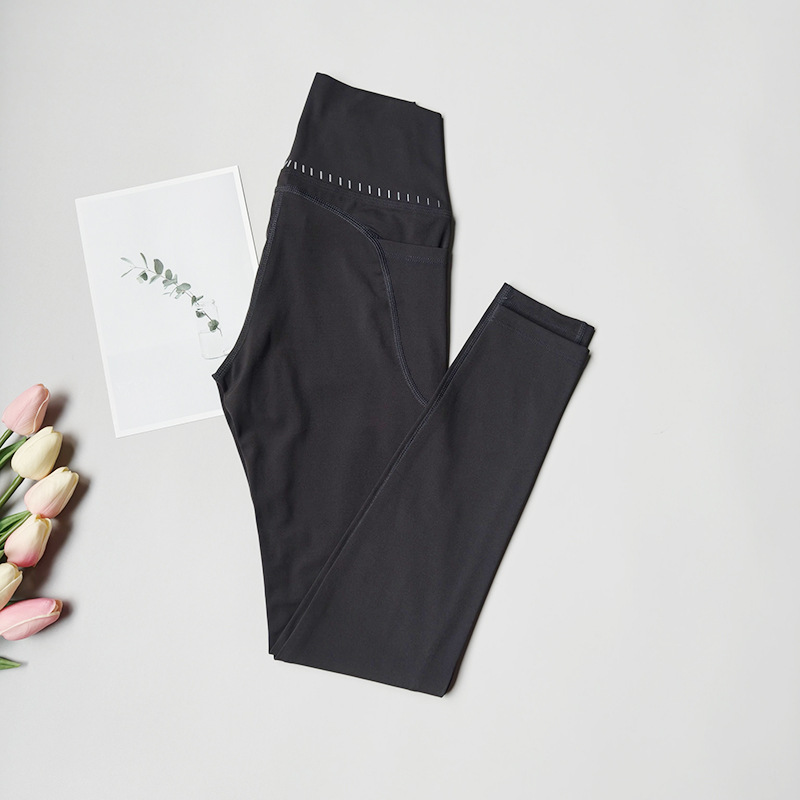 Pantalones de fitness desnudos para mujeres sonrientes líneas de elevación de cadera pantalones deportivos para mujeres al aire libre cintura alta sin marcas nueve puntos pantalones de calzado