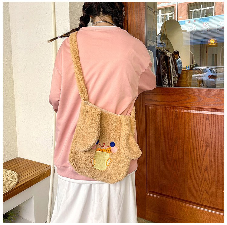 This autumn and winter hand-held bag with big ears, cute animal-embroidered fur, and a simple lambskin large-capacity student backpack undefined