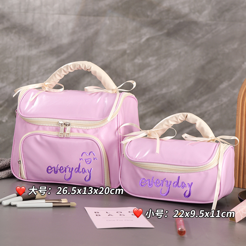 Capacious handheld cosmetic bag with bow to go out