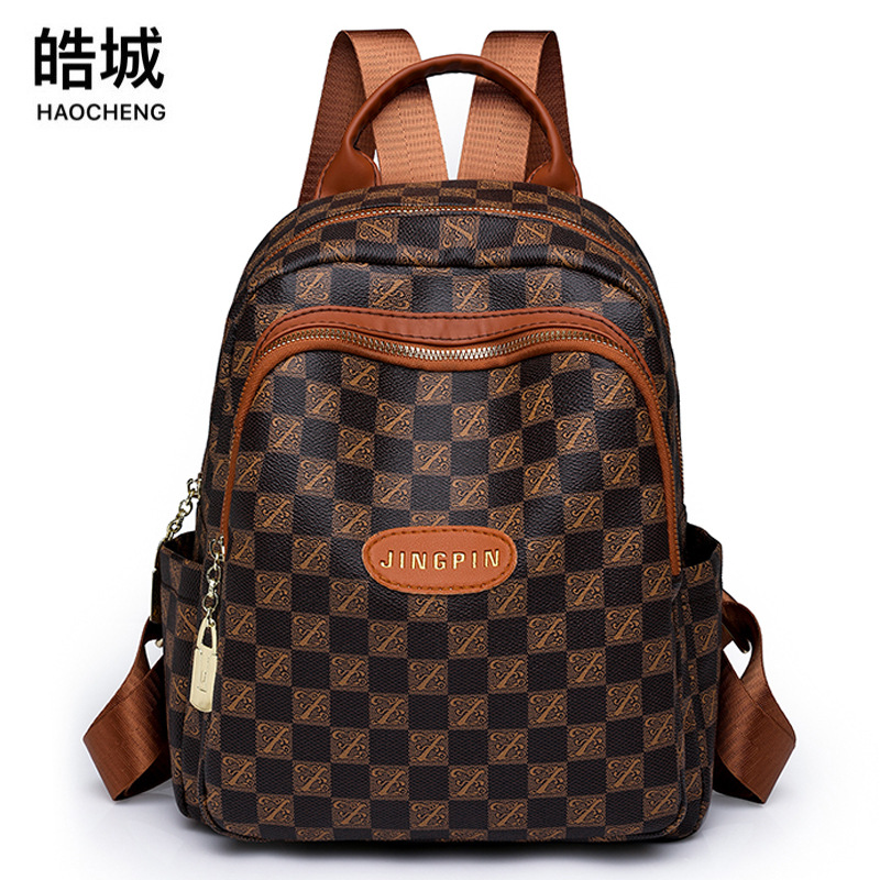 Spot al por mayor 2023 invierno nuevas señoras retro PU mochila de viaje de color de contraste de moda mochila escolar