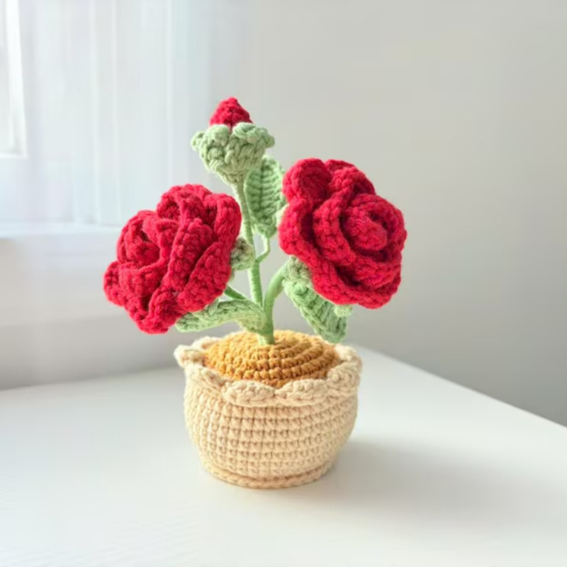 Rosa roja de doble cabeza en maceta