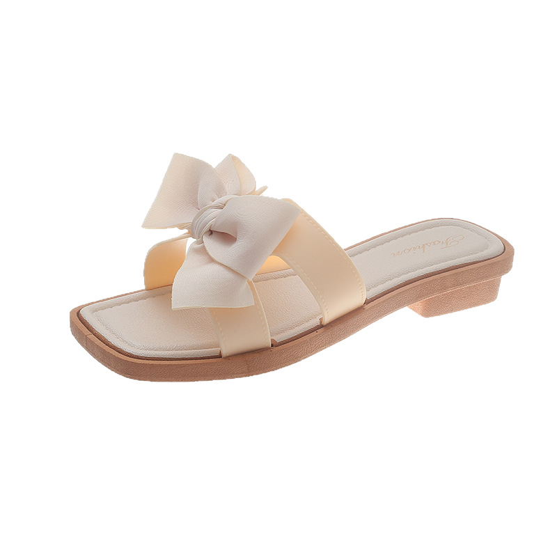 Fragrant wind bowknot zapatillas de una sola palabra mujer verano ropa exterior celebridad de Internet nueva moda fondo plano estilo hada sandalias fondo suave todo fósforo