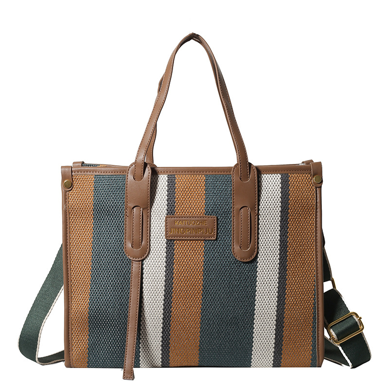 Bolso Tote portátil a rayas de color de contraste de lona para mujer 2024 nueva textura de moda transfronteriza bolso de mensajero de un solo hombro