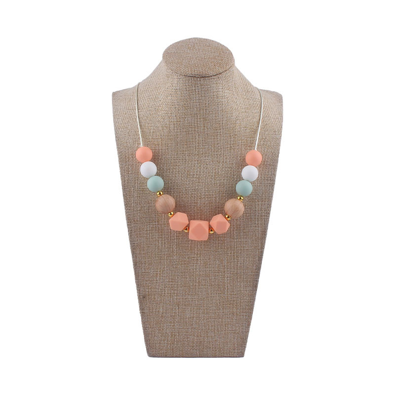 Los nuevos bebés de contraste de color de silicona octogonal mordedor collar de los bebés mordedor palo masticable colgante collar