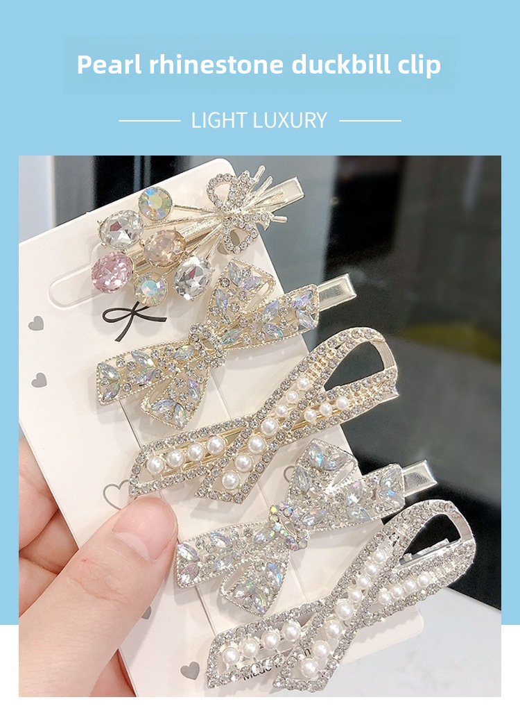 Set di fermagli per capelli eleganti con fiocco perle e cristalli_voghion.com