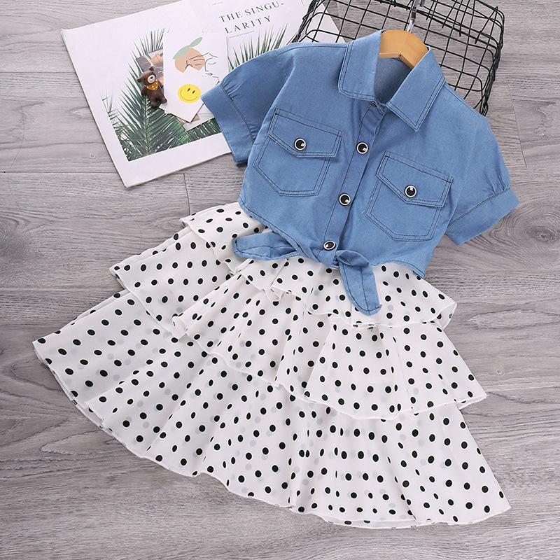 Explosiva ropa de niña transfronteriza 2025 verano para niños nueva chaqueta de mezclilla de manga corta traje de falda de princesa al por mayor