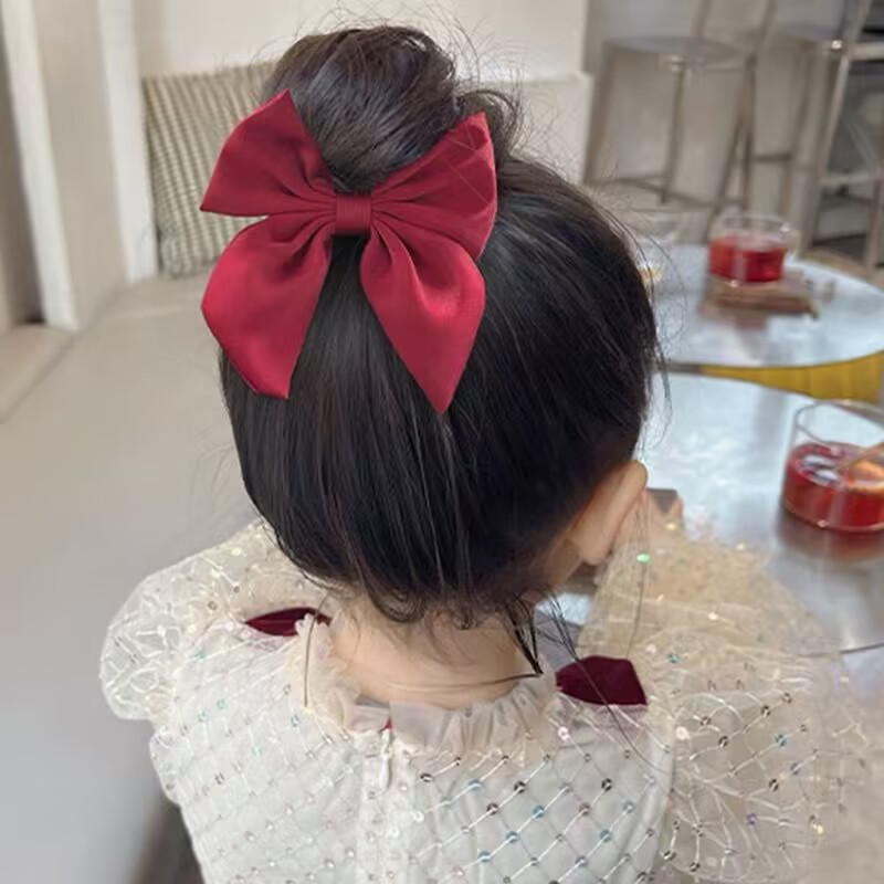 赤い蝶結びの髪飾りのヘアピン子供のサテンの新年の髪飾りの後頭部のカモの口は高級感のあるヘアピンを挟みます。|undefined