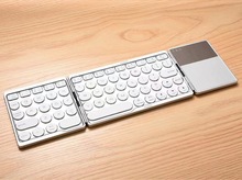 三系统通用折叠蓝牙键盘圆键帽带手写板键盘三折触控键盘跨境新款