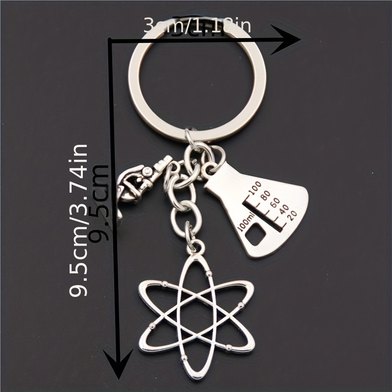 Serie de oro de aleación de venta transfronteriza caliente fútbol béisbol rugby sombrero hechicero puño llavero colgante mochila