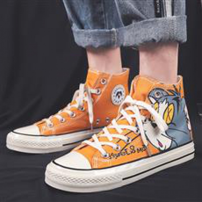 Zapatos de hombre caliente zapatos de skate 2025, cuatro temporadas nuevas zapatos de lona de gato y ratón de alta altura, tendencia de moda casual para hombres.