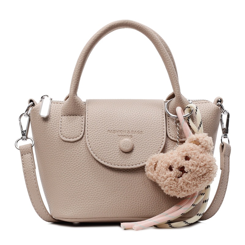 Bolsos pequeños de mano más vendidos de comercio exterior para mujer 2025 nuevo bolso cuadrado pequeño simple y todo fósforo textura casual bolso de mensajero de un solo hombro