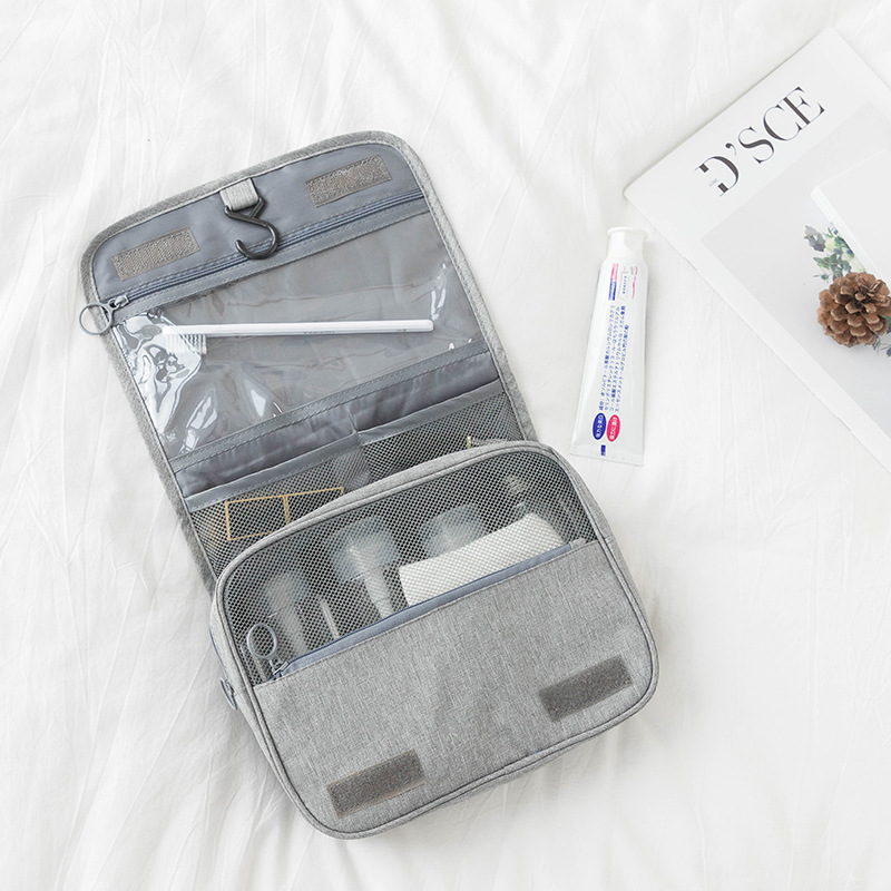 Fabricante de regalos de bolsa de lavado de estilo minimalista nórdico Logotipo personalizado rápido Bolsa de tocador de gancho de calidad de tela Oxford al por mayor