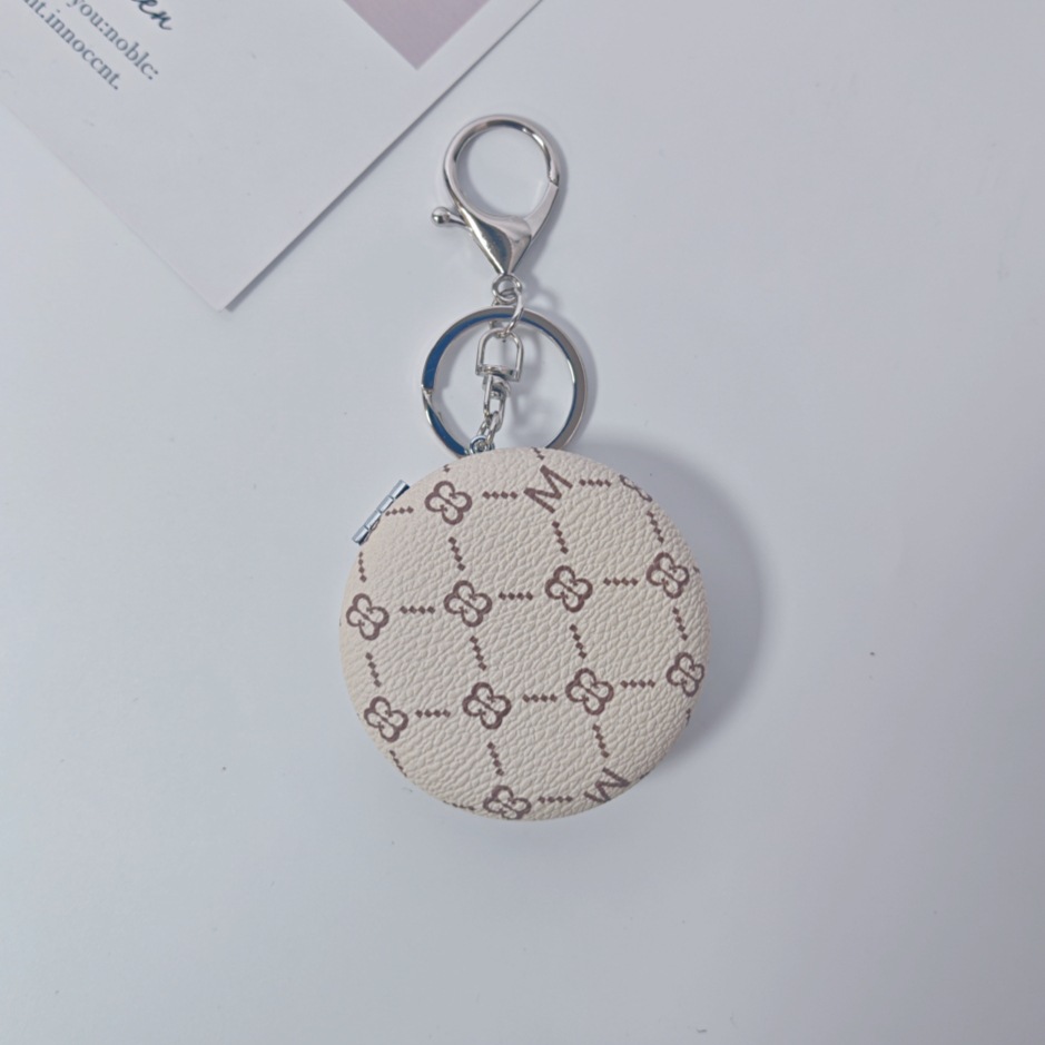 Bolsa de espejo popular en línea colgante de lujo ligero llavero portátil espejo de maquillaje transfronterizo colgante de bolsas de espejo doble cara