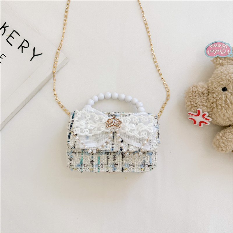 2024 nueva moda lindas bolsas de hombro para niños bolsas de perlas a cuadrícula bolsas extranjeras bolsas de hombro para niñas gran capacidad marea