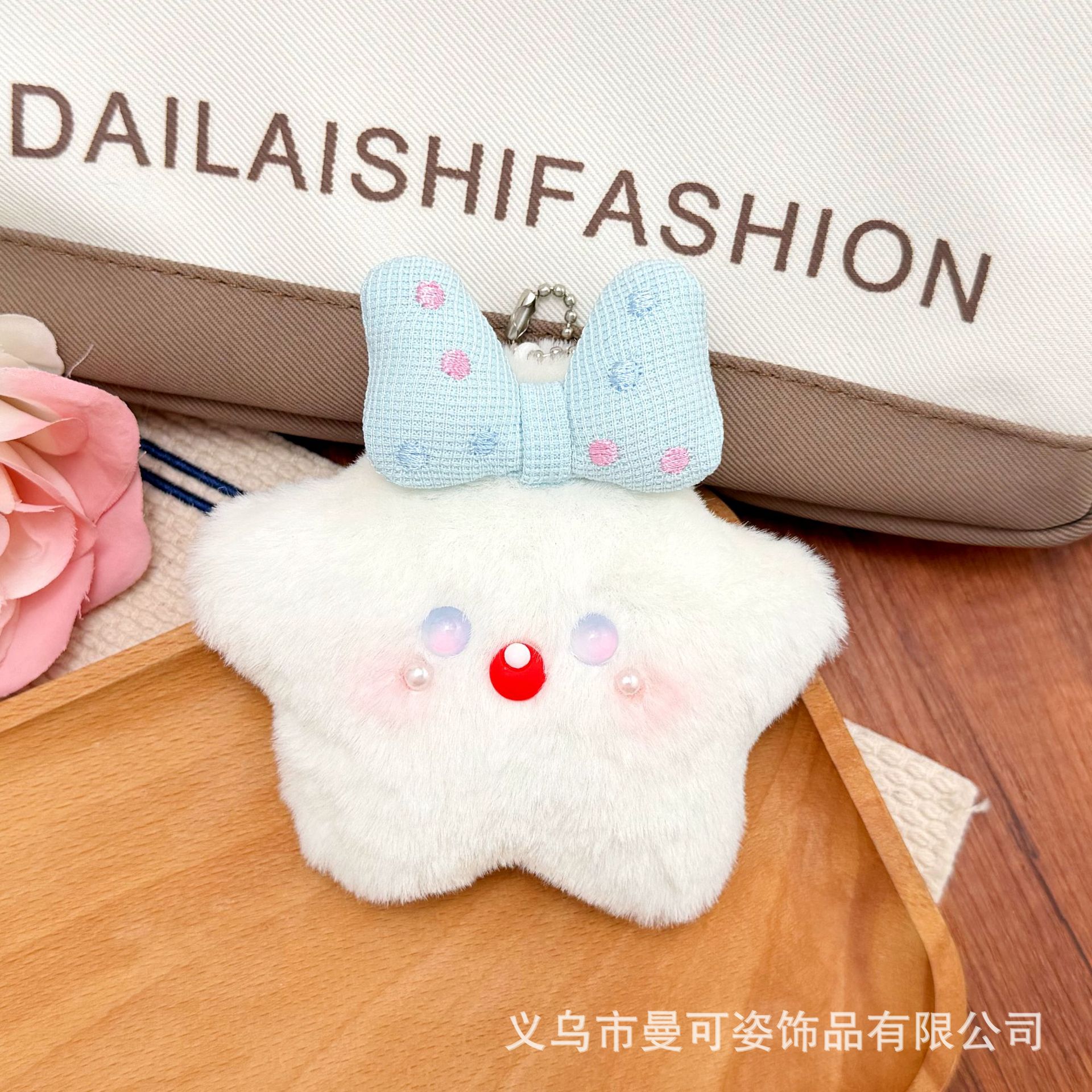 Blue polka dot bow with star on its mouth