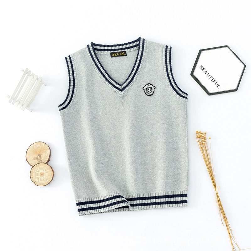 Chaleco de punto estilo universitario coreano para niños, primavera y otoño 2025, chaleco de algodón con cuello en V para niños, suéter para estudiantes de primaria, venta al por mayor.