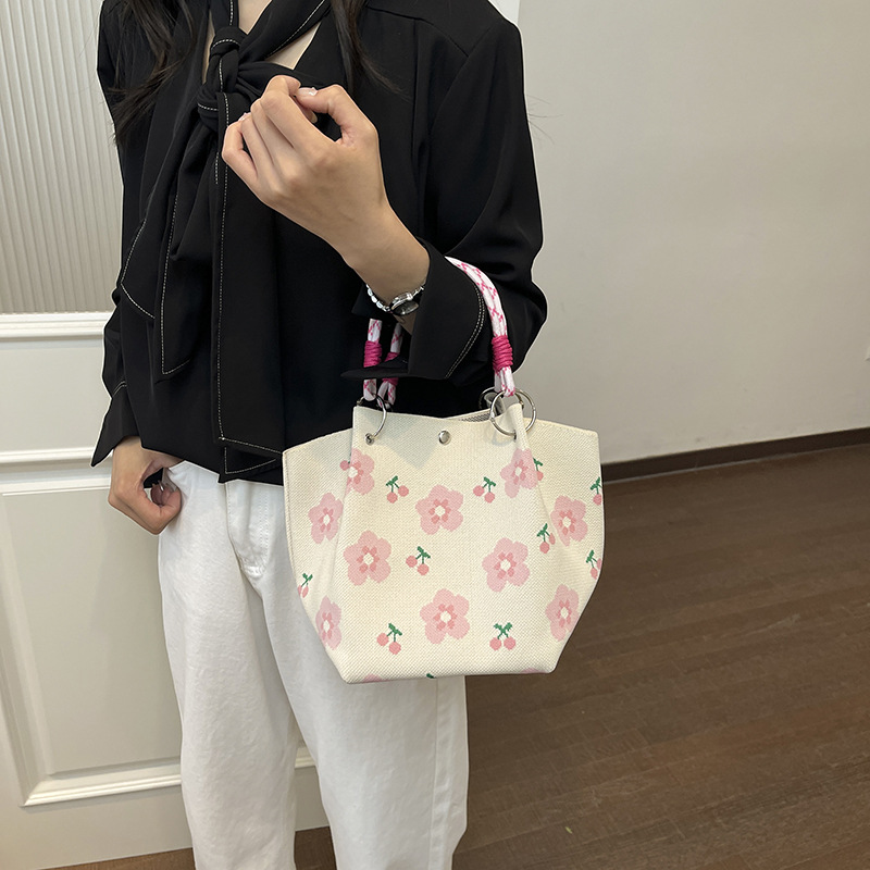 Bolsa de impresión coreana de niña nicho bolso de cubo de diseño diario versátil bolso de mano para estudiantes de viaje diario
