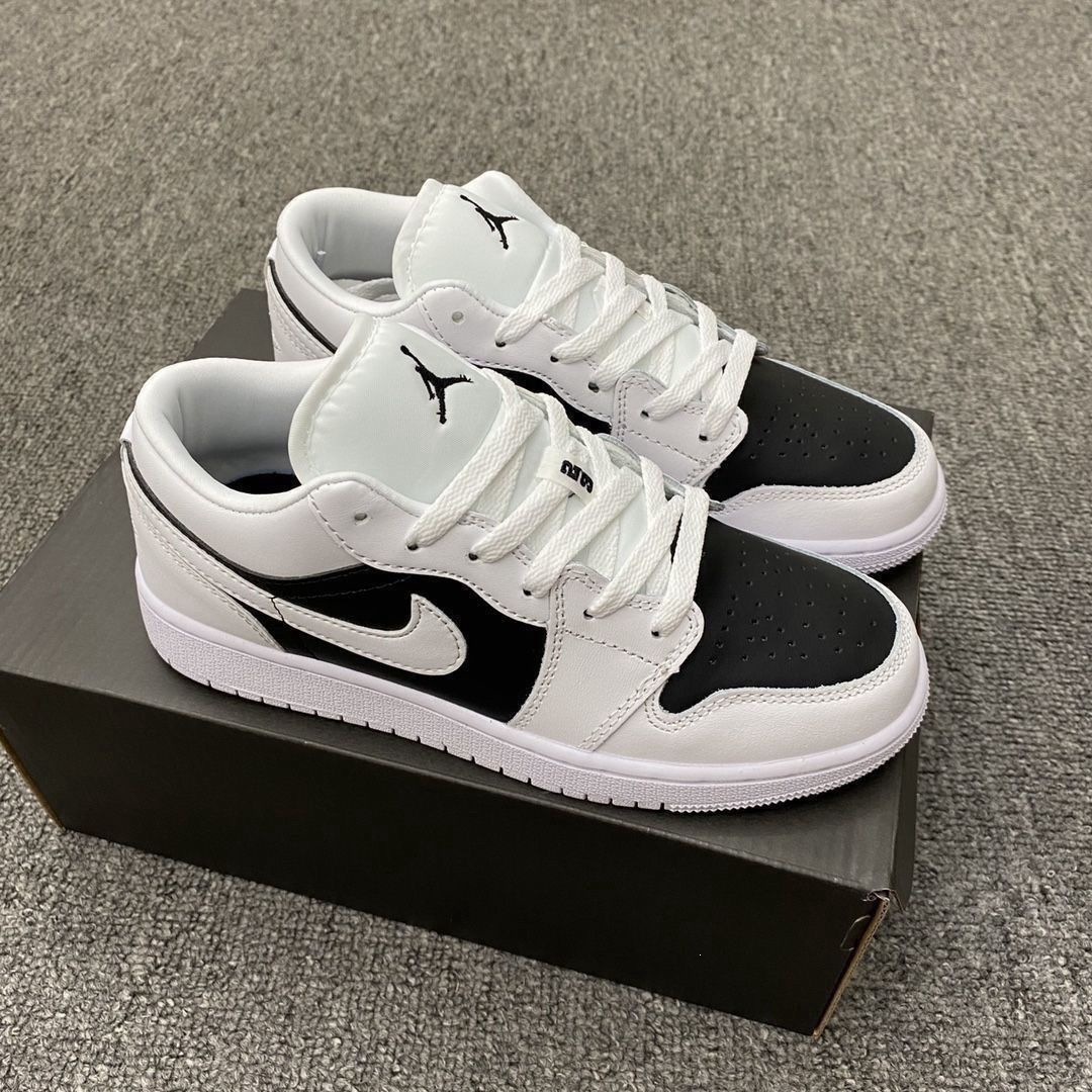 Chunyuan AJ1 Meituan negro, blanco y amarillo campus de moda baja pareja de hombres y mujeres zapatos de skate casuales