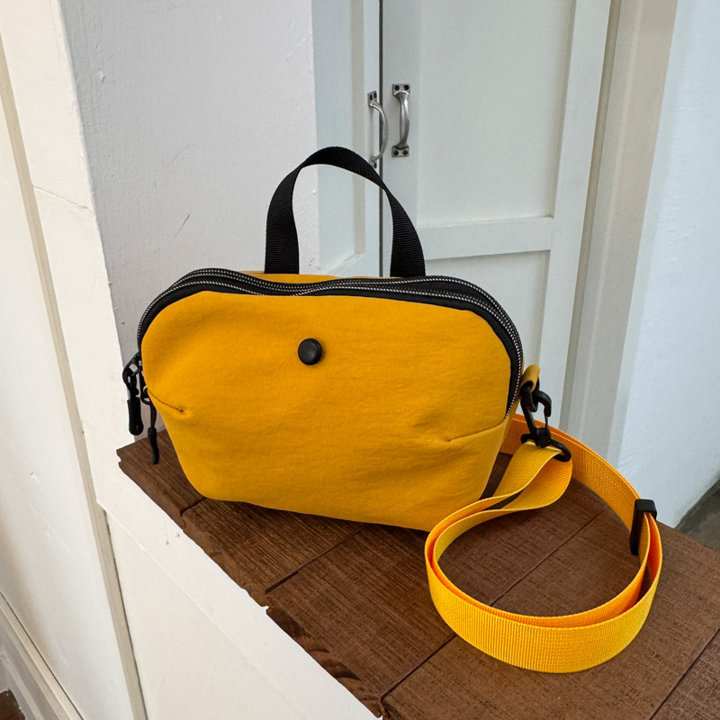 Bolsos pequeños de moda coreana 2025 verano nuevo estilo bolso femenino bolso de lona simple bolso de hombro casual bolso de mensajero con correa de hombro ancha