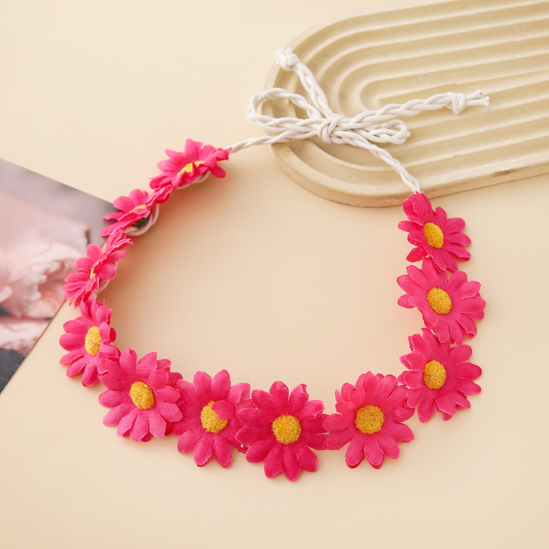 女性の女の子のヘアバンドは11輪の花の頭を編んで小さい太陽の花を持って旅行します。|undefined