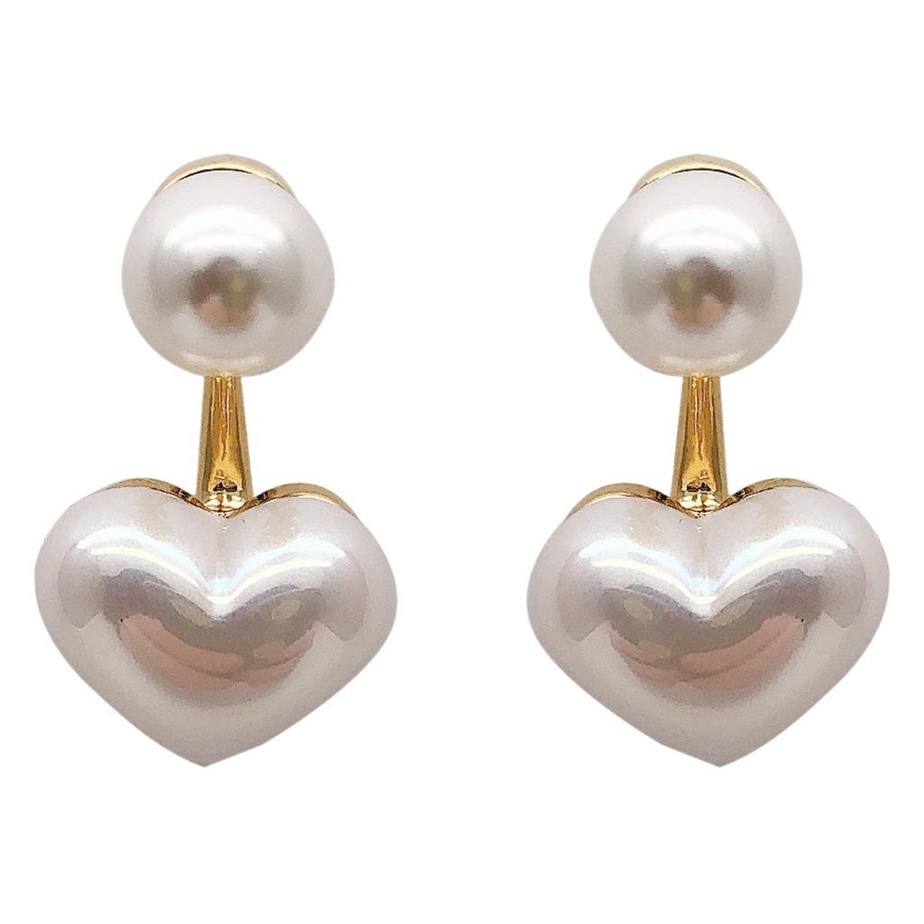 Aguja de plata Pendientes de perlas de amor pequeños simples Pendientes de niña Dongdaemun de Corea Pendientes de lujo ligero de temperamento al por mayor de celebridades de Internet